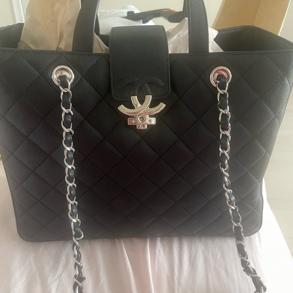 Chanel tote black with silver chain and hardware. preowned.12X10 authentic
